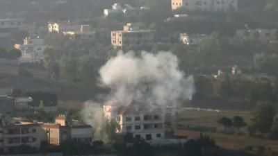 Smoke rises from the southern Lebanese town of Khiam, amid ongoing cross-border hostilities between Hezbollah and Israeli forces, as pictured from Marjayoun, near the border with Israel, August 25, 2024. REUTERS/Karamallah Daher