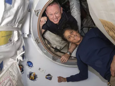 FILE - In this photo provided by NASA, Boeing Crew Flight Test astronauts Butch Wilmore, left, and Suni Williams pose for a portrait inside the vestibule between the forward port on the International Space Station's Harmony module and Boeing's Starliner spacecraft on June 13, 2024. (NASA via AP, File)