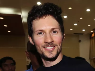 FILE - Telegram co-founder Pavel Durov, center, smiles following his meeting with Indonesian Communication and Information Minister Rudiantara in Jakarta, Indonesia on Aug. 1, 2017. (AP Photo/Tatan Syuflana, File)