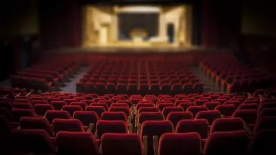 Empty red armchairs of a theater ready for a show