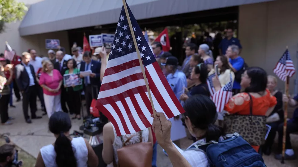 Supporters attend a news conference where officials with the League of United Latin American Citizens, or LULAC, held a news conference to respond to allegations by Texas Attorney General Ken Paxton, Monday, Aug. 26, 2024, in San Antonio. (AP Photo/Eric Gay)