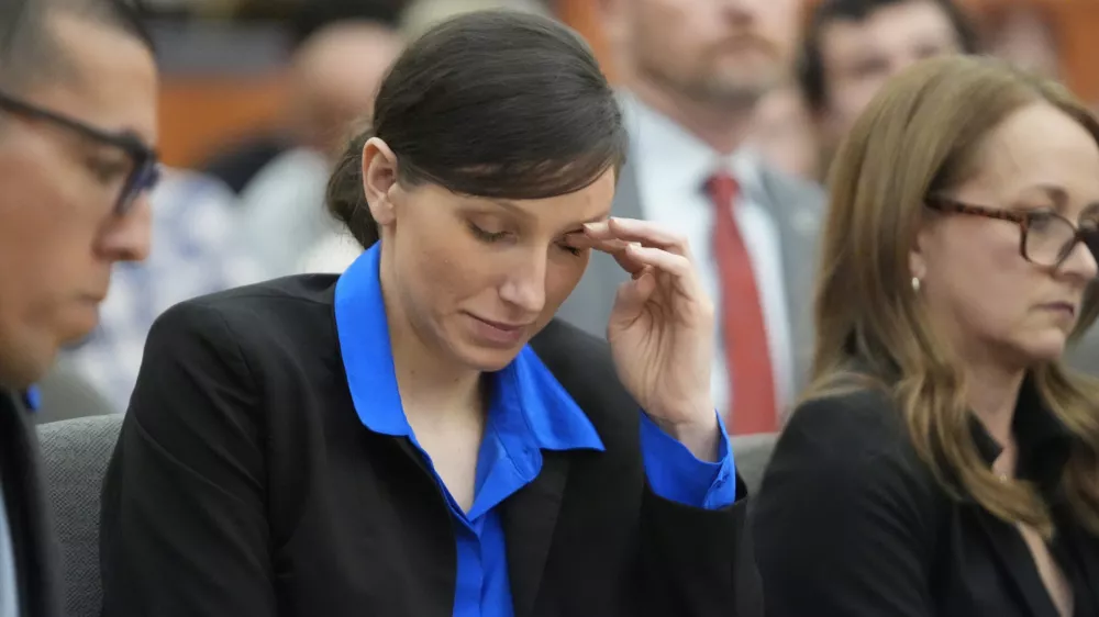 Kouri Richins, a Utah mother of three who wrote a children's book about coping with grief after her husband's death and was later accused of fatally poisoning him, looks on during a hearing Tuesday, Aug. 27, 2024, in Park City, Utah. (AP Photo/Rick Bowmer, Pool)