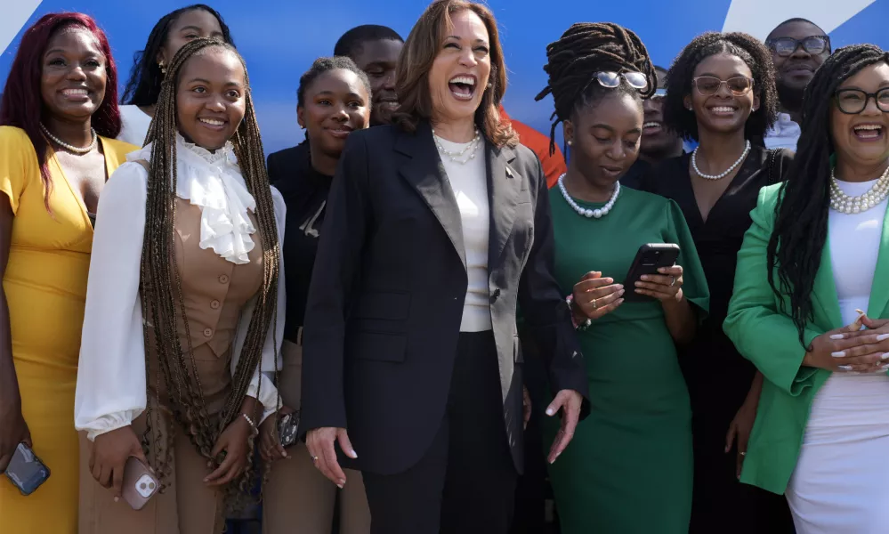 Democratic presidential nominee Vice President Kamala Harris pose for a photo with supporters at the Savannah/Hilton Head International Airport in Savannah, Ga., as before campaign events, Wednesday, Aug. 28, 2024. (AP Photo/Jacquelyn Martin)