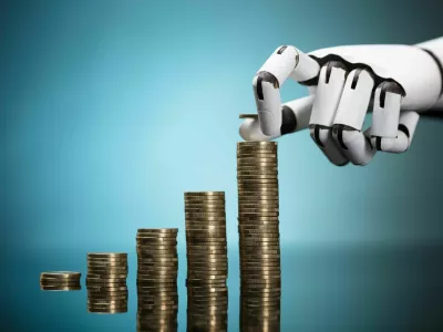 Close-up Of A Robot's Hand Stacking Golden Coins On Turquoise Background / Foto: Andreypopov