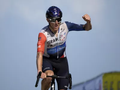 Canada's Michael Woods approaches the finish line to win the ninth stage of the Tour de France cycling race over 182.5 kilometers (113.5 miles) with start in Saint-Leonard-de-Noblat and finish in Puy de Dome, France, Sunday, July 9, 2023. (AP Photo/Daniel Cole)