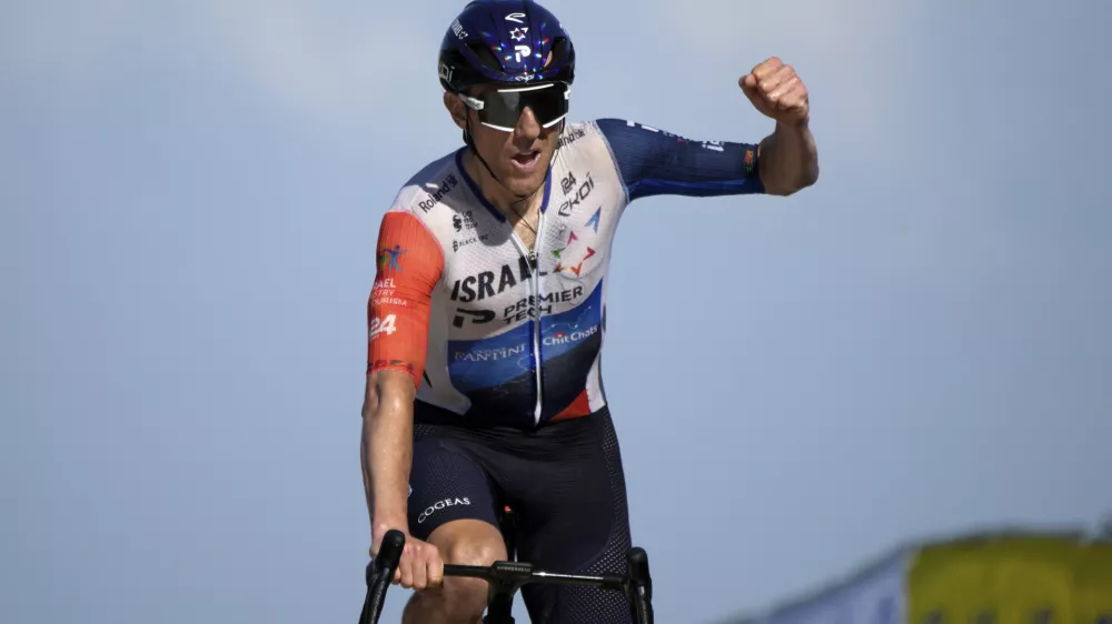 Canada's Michael Woods approaches the finish line to win the ninth stage of the Tour de France cycling race over 182.5 kilometers (113.5 miles) with start in Saint-Leonard-de-Noblat and finish in Puy de Dome, France, Sunday, July 9, 2023. (AP Photo/Daniel Cole)