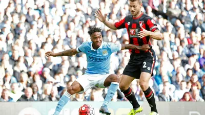 FILE PHOTO: Football - Manchester City v AFC Bournemouth - Barclays Premier League - Etihad Stadium - 17/10/15 Manchester City's Raheem Sterling and Bournemouth's Simon Francis Reuters / Andrew Yates Livepic EDITORIAL USE ONLY. No use with unauthorized audio, video, data, fixture lists, club/league logos or "live" services. Online in-match use limited to 45 images, no video emulation. No use in betting, games or single club/league/player publications. Please contact your account representative for further details./File Photo