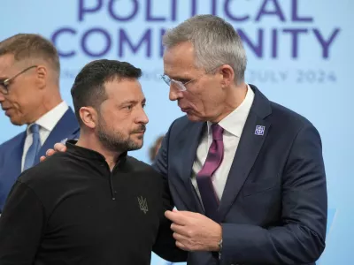 FILE PHOTO: Ukrainian President Volodymyr Zelenskiy speaks to the Nato Secretary General Jens Stoltenberg before the first plenary session at the European Political Community meeting at Blenheim Palace in Woodstock, Britain, Thursday, July 18, 2024. Kin Cheung/Pool via REUTERS/File Photo