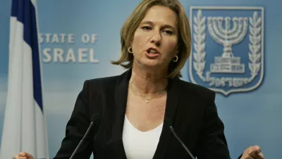 Israeli Foreign Minister Tzipi Livni gestures as she answers a reporter's question during a joint news conference with Germany's Foreign Minister Frank-Walter Steinmeier, not seen, following their meeting in Jerusalem, Sunday Jan. 11, 2009. Steinmeier was set to hold talks with Israeli leaders Sunday in Egypt in an attempt to advance the Security Council's cease-fire call. 'Israel must be persuaded to let the firearms rest now,' Steinmeier told reporters Sunday. (AP Photo/Lefteris Pitarakis)