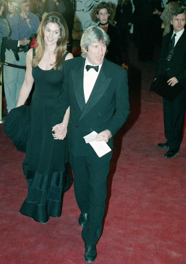 Actor Richard Gere and his wife, supermodel Cindy Crawford, arrive at the 13th annual Council of Fashion Designers of America Awards gala on February 7, 1994, at Lincoln Center in New York. (AP Photo/Jim Cooper)