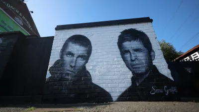 A mural of Oasis band members Liam and Noel Gallagher by artist Snow Graffiti is seen on the wall of the Coach and Horses pub in Whitefield, near Manchester, Britain, August 31, 2024. REUTERS/Phil Noble