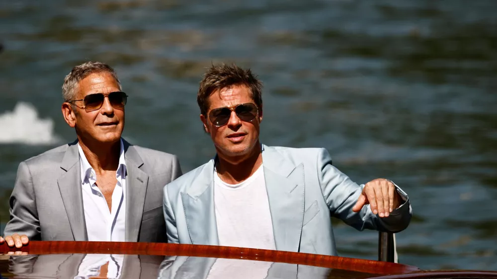 Actors Brad Pitt and George Clooney arrive during the 81st Venice Film Festival, in Venice, Italy, September 1, 2024. REUTERS/Yara Nardi