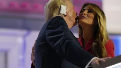 Republican presidential candidate former President Donald Trump, greets his wife, Melania Trump on stage during the Republican National Convention, Thursday, July 18, 2024, in Milwaukee. (AP Photo/Julia Nikhinson)