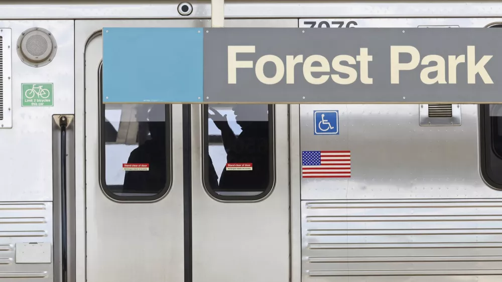 Police investigators work inside a CTA Blue Line train parked at the Forest Park station after a shooting, Monday, Sept. 2, 2024, in Forest Park, Ill. (John J. Kim/Chicago Tribune via AP)