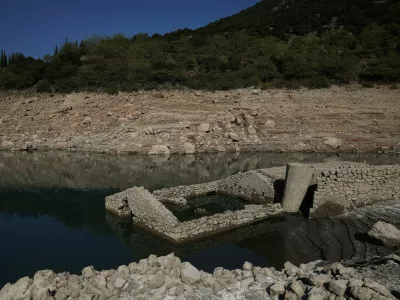 The reappearing remains of a building of the village of Kallio, which was intentionally flooded in 1980 to create a reservoir that would help meet the water needs of Greek capital Athens, are seen following receding water levels caused by drought, in Lake Mornos, Greece, September 3, 2024. REUTERS/Stelios Misinas