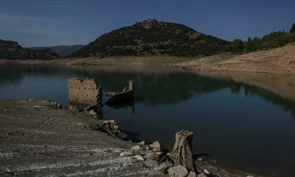 The reappearing remains of buildings of the village of Kallio, which was intentionally flooded in 1980 to create a reservoir that would help meet the water needs of Greek capital Athens, are seen following receding water levels caused by drought, in Lake Mornos, Greece, September 3, 2024. REUTERS/Stelios Misinas