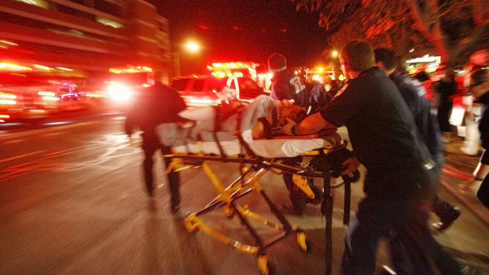 A male is moved from the Trolley Square Mall to an ambulance after a gunman opened fire in the mall hitting several people before he was killed by police Monday, Feb. 12, 2007, in Salt Lake City.(AP Photo/The Salt Lake Tribune, Danny Chan La) ** DESERET NEWS OUT **