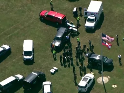 First responders gather after law enforcement officers responded to a fatal shooting at Apalachee High School in a still image from aerial video in Winder, Georgia, U.S. September 4, 2024.  ABC Affiliate WSB via REUTERS.  NO RESALES. NO ARCHIVES. MANDATORY CREDIT