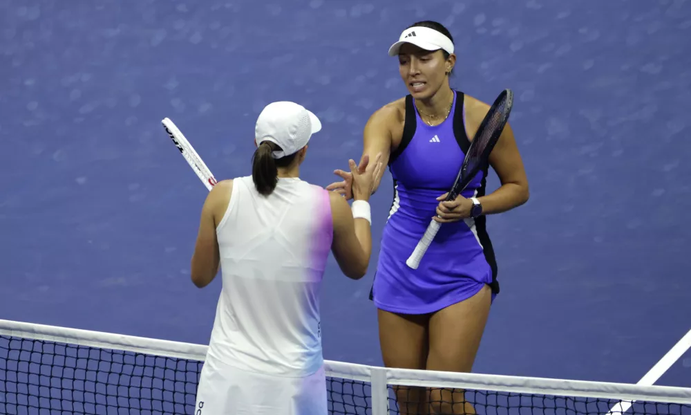 Jessica Pegula, of the United States, right, shakes hands after defeating Iga Świątek, of Poland, left, during the quarterfinals of the U.S. Open tennis championships, Wednesday, Sept. 4, 2024, in New York. (AP Photo/Adam Hunger)