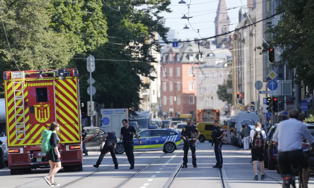 Police officers block a street after police fired shots at a suspicious person near the Israeli Consulate and a museum on the city's Nazi-era history in Munich, Germany, Thursday, Sept. 5, 2024. (AP Photo/Matthias Schrader)