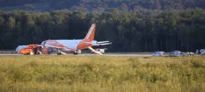 ﻿In this June 10, 2017 photo taken from video, a EasyJet plane stands at Cologne-Bonn airport, in Cologne Germany. German police are questioning three British citizens after their conversation during a flight to London prompted an EasyJet pilot to make an unscheduled stop in Cologne late Saturday. A spokesman for Cologne police says other passengers on the flight from the Slovenian capital Ljubljana overheard a conversation with "terrorist content" between the men, aged 31, 38 and 48. Airport authorities said in a statement that the 151 passengers on board disembarked the plane using emergency slides. (Thomas Kraus/dpa via AP)