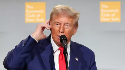 Republican presidential nominee and former U.S. President Donald Trump points to his ear as he speaks at the Economic Club of New York in New York City, U.S. September 5, 2024. REUTERS/Brendan McDermid