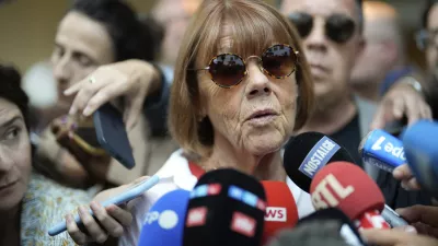 Gisele Pelicot speaks to media as she leaves the Avignon court house, southern France, Thursday, Sept. 5, 2024. A woman allegedly drugged by her ex-husband so that she could be raped by other men while she laid unconscious, is expected to testify before a panel of French judges. (AP Photo/Lewis Joly)