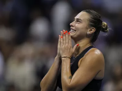 Aryna Sabalenka, of Belarus, smiles after defeating Emma Navarro, of the United States, during the women's singles semifinals of the U.S. Open tennis championships, Thursday, Sept. 5, 2024, in New York. (AP Photo/Seth Wenig)