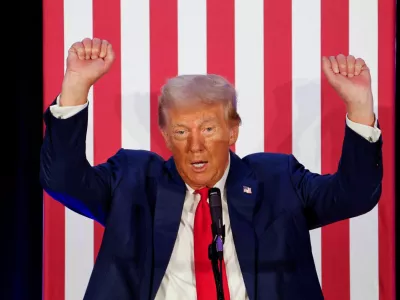 Republican presidential nominee and former U.S. President Donald Trump gestures as he addresses the Fraternal Order of Police at their meeting in Charlotte, North Carolina, U.S. September 6, 2024. REUTERS/Jonathan Drake   TPX IMAGES OF THE DAY