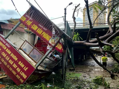 A man walks past a devastated area following the impact of Typhoon Yagi, in Hanoi, Vietnam, September 8, 2024. REUTERS/Thinh Nguyen