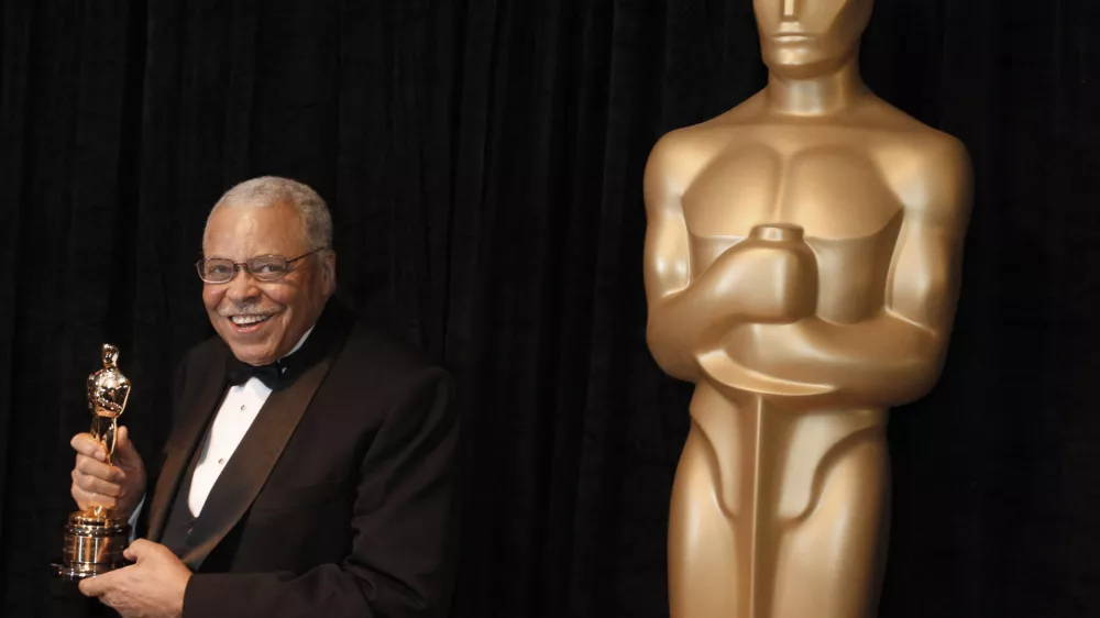 FILE - James Earl Jones poses with his honorary Oscar at the 84th Academy Awards on Sunday, Feb. 26, 2012, in the Hollywood section of Los Angeles. Jones, who overcame racial prejudice and a severe stutter to become a celebrated icon of stage and screen has died at age 93, Monday, Sept. 9, 2024. (AP Photo/Chris Carlson, File)