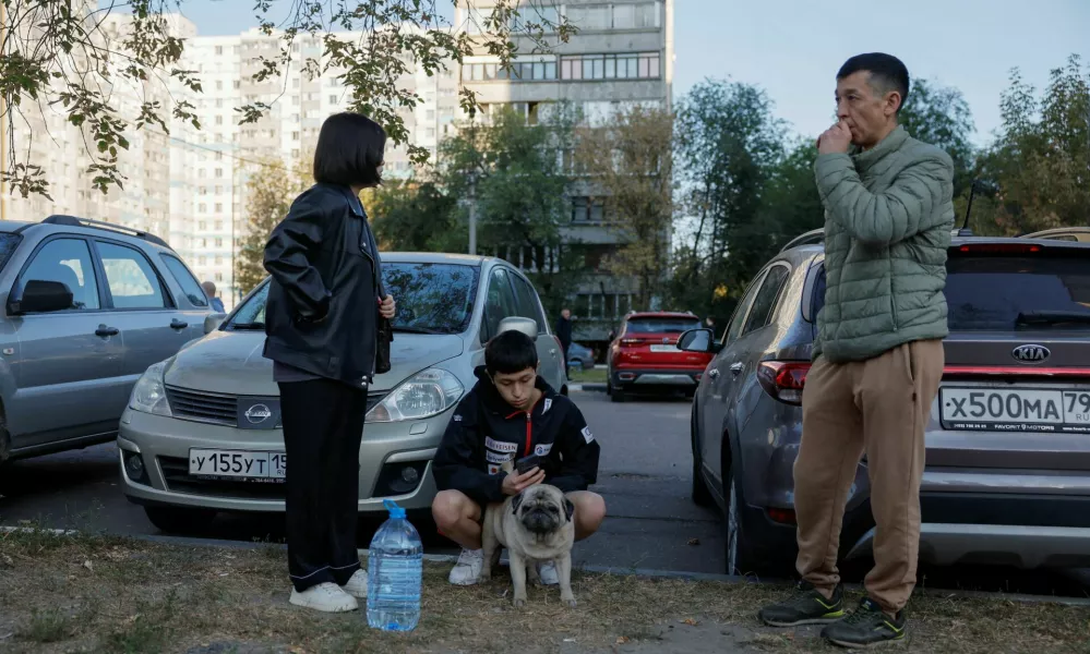 Local residents gather in the courtyard of a damaged multi-storey building following an alleged Ukrainian drone attack in the course of Russia-Ukraine conflict, in Ramenskoye in the Moscow region, Russia September 10, 2024. REUTERS/Maxim Shemetov