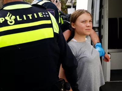 Swedish climate campaigner Greta Thunberg is detained by police, on the day climate activists try to block the A12 highway to ensure that the Dutch government stops subsidies for fossil fuels, in The Hague, Netherlands, April 6, 2024. REUTERS/Piroschka van de Wouw