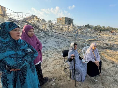 Palestinian women look on at the site following Israeli strikes on a tent camp sheltering displaced people, amid the Israel-Hamas conflict, at the Al-Mawasi area in Khan Younis, in the southern Gaza Strip, September 10, 2024. REUTERS/Mohammed Salem   TPX IMAGES OF THE DAY