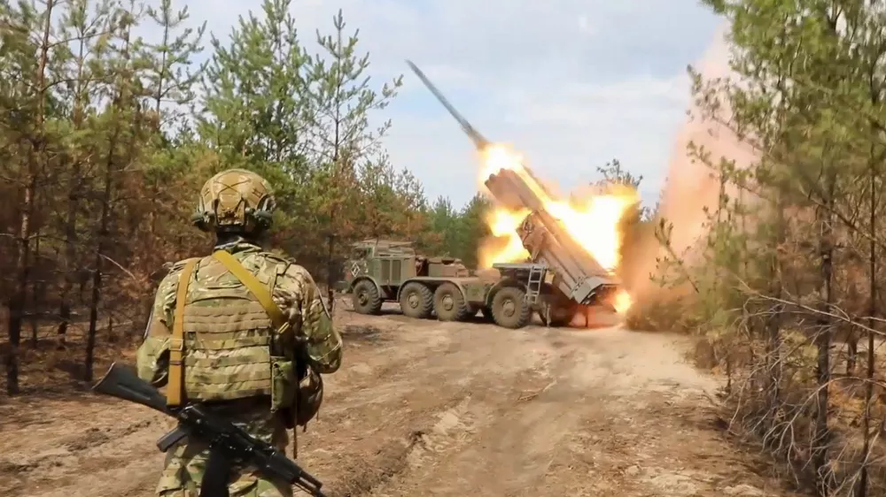 In this photo taken from a video released by Russian Defense Ministry press service on Tuesday, Sept. 10, 2024, an Uragan multiple rocket launcher fires at an undisclosed location. (Russian Defense Press Service via AP)