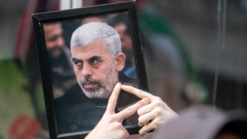 A pro-Palestinian protester holds up a portrait of Hamas leader Yahya Sinwar outside of a campaign event for Democratic presidential candidate and U.S. Vice President Kamala Harris in New York City, U.S., August 14, 2024. REUTERS/David 'Dee' Delgado