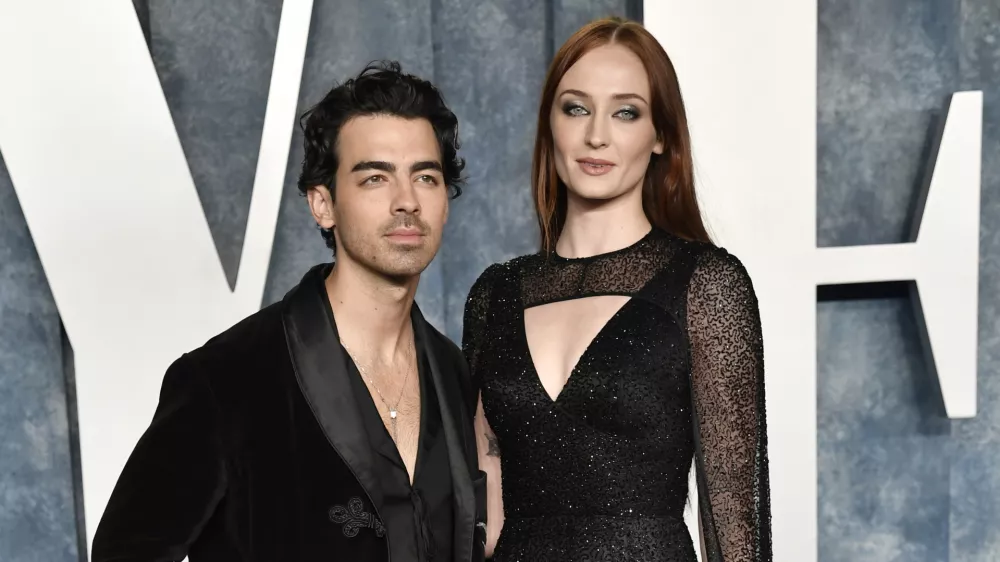 FILE - Joe Jonas, left, and Sophie Turner appear at the Vanity Fair Oscar Party on March 12, 2023, in Beverly Hills, Calif. (Photo by Evan Agostini/Invision/AP, File)