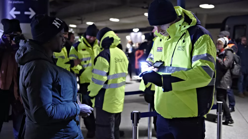 ﻿A passenger has her ID checked at the train station Copenhagen International Airport in Kastrup to prevent illegal migrants entering Sweden on Monday Jan. 4, 2016. The station is the last stop before crossing the Oresund Bridge into Sweden. Sweden requires train companies with service across a bridge-and-tunnel link from Denmark to refuse passengers without ID. (Tariq Mikkel Khan/Polfoto via AP)