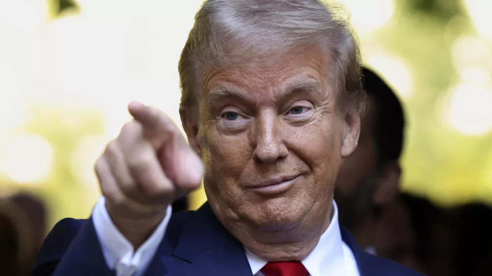 Republican presidential nominee former President Donald Trump motions while attending the 9/11 Memorial ceremony on the 23rd anniversary of the Sept. 11, 2001 terror attacks, Wednesday, Sept. 11, 2024, in New York. (AP Photo/Yuki Iwamura)