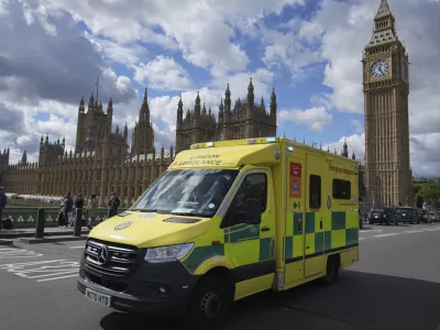 An ambulance drives along Westminster Bridge in London, as Prime Minister Keir Starmer makes a major speech on the NHS, Thursday, Sept. 12, 2024. (AP Photo/Kin Cheung)