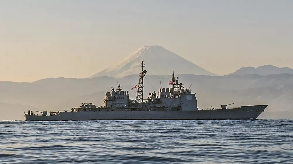 Ticonderoga-class guided-missile cruiser USS Antietam (CG 54) is underway off the coast of Japan near Mt. Fuji. Antietam is on patrol in the 7th Fleet area of operations in support of security and stability in the Indo-Asia-Pacific region, Nov. 22, 2014. The U.S. Navy is sailing the USS Antietam and the USS Chancellorsville warships through the Taiwan Strait Sunday, in the first such transit publicized since US House Speaker Nancy Pelosi visited Taiwan earlier in August, at a time where tensions have kept the waterway particularly busy. (Mass Communication Specialist Seaman David Flewellyn/U.S. Navy via AP)