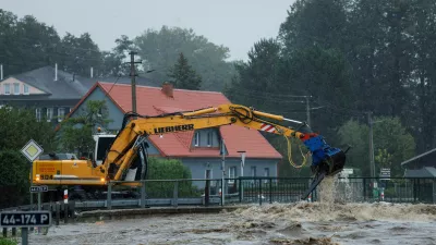 An excavator operates following heavy rainfalls in Pisecna, Czech Republic, September 14, 2024. REUTERS/David W Cerny