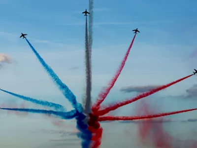 Aircrafts of the Patrouille de France fly over Paris during a parade at the Champs-Elysees avenue for all the French athletes who participated in the 2024 Olympics and Paralympics, in Paris, France September 14, 2024. REUTERS/Gonzalo Fuentes/Pool   TPX IMAGES OF THE DAY