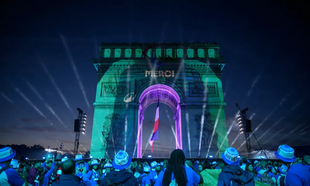 The word "Merci" (Thank you) is displayed on the Arc de Triomphe at the end of the parade of French athletes who competed in the Paris 2024 Olympic and Paralympic Games in Paris, France, September 14, 2024. ED JONES/Pool via REUTERS