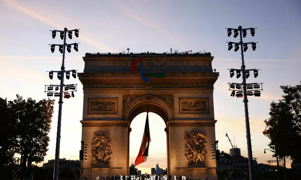 A general view of Arc de Triomphe with athletes, President Emmanuel Macron and other participants of the Paris Olympic and Paralympic Games during a ceremony to award the Legion d'Honneur medals to French Olympian medalists, in Paris, France, 14 September 2024. Mohammed Badra/Pool via REUTERS