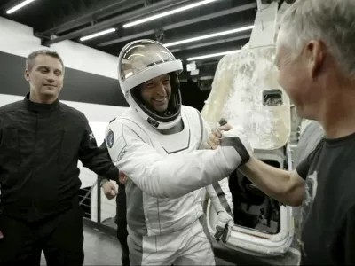 In this image made from SpaceX video, tech entrepreneur Jared Isaacman, center, greets as he gets out of its capsule upon his return with his crew after the capsule landed in the Gulf of Mexico near Florida's Dry Tortugas early Sunday, Sept. 15, 2024. (SpaceX via AP)