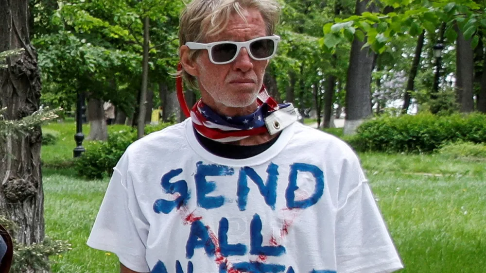 FILE PHOTO: Ryan W. Routh, a suspect identified by news organizations, as the FBI investigates what they said was an apparent assassination attempt in Florida on Republican presidential nominee and former U.S. President Donald Trump, is seen during a rally demanding China's leader's assistance to organise an extraction process for Ukrainian service members from Azovstal Iron and Steel Works in Mariupol, in Kyiv, Ukraine May 17, 2022. REUTERS/Valentyn Ogirenko/File Photo