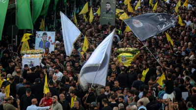 18 September 2024, Lebanon, Beirut: Hezbollah supporters carry the coffins of the victims who were killed in electronic pagers explosion, during a funeral procession in Beirut southern suburb. Thousands people were wounded in the cyberattack and 12 were killed so far in the latest toll announced by the ministry of health. Hezbollah has blamed Israel for the detonations on 17 September and promised retaliation. Several of its fighters, as well as high-ranking representatives and members of the Radwan Force, an elite unit within the group, are said to be among the victims. Photo: Marwan Naamani/dpa