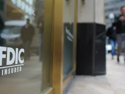 FILE PHOTO: A sign reads "FDIC Insured" on the door of a branch of First Republic Bank in Boston, Massachusetts, U.S., March 13, 2023.   REUTERS/Brian Snyder/File Photo