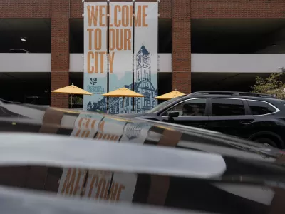 A banner with the images of the Heritage Center of Clark County and "Welcome To Our City," hangs along North Fountain Ave. Tuesday, Sept. 17, 2024, in Springfield, Ohio. (AP Photo/Carolyn Kaster)